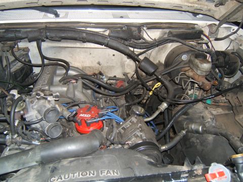1988 Ford Bronco - Engine bay details, including an MSD ignition distributor and fan warning label.