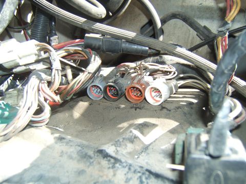 1988 Ford Bronco - Close-up view of various engine wiring harness connectors and their associated wiring.