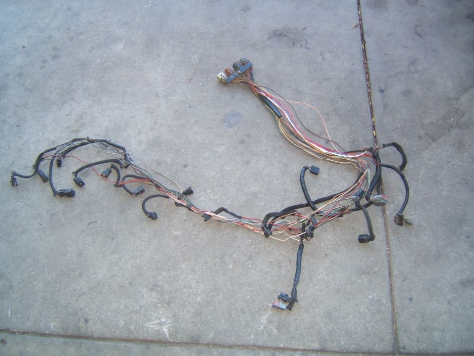 Vehicle wiring harness laid out on concrete ground