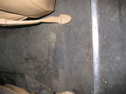 1987 Dodge 1500 - View of the interior floor and lower seat area of a vehicle.