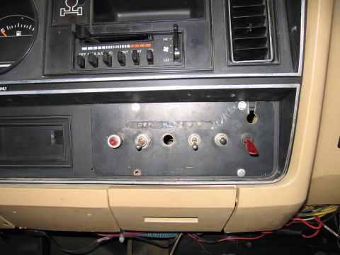 1987 Dodge 1500 - Interior view of a dashboard with several aftermarket auxiliary switches installed.