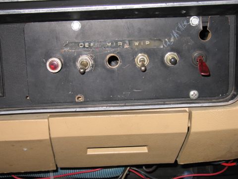 1987 Dodge 1500 - Close-up of a vehicle's dashboard showing various switches and labels, including DEF, MIR, and WIP.