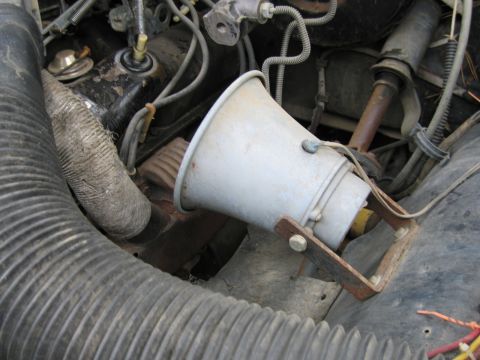 1987 Dodge 1500 - A speaker is mounted in the engine bay, surrounded by hoses and wiring.