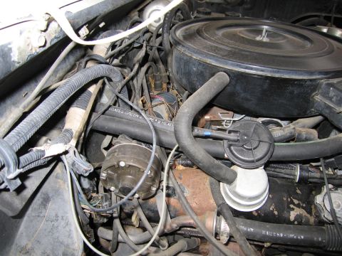 1987 Dodge 1500 - Close-up view of an engine bay, showing various components and wiring.