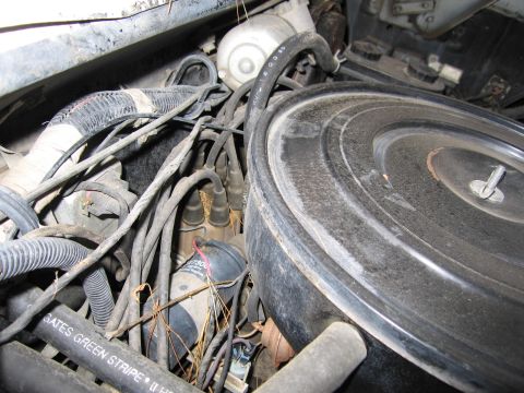 1987 Dodge 1500 - Close-up view of a vehicle's engine bay, showing various components and wiring.