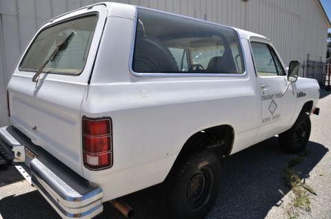 1987 Dodge 1500 - Side view of a white 1987 Dodge Ramcharger SUV, marked for Terraquay Creek School District.