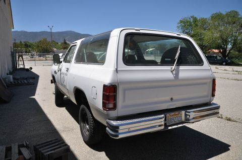 1987 Dodge 1500 - Rear view of a white 1987 Dodge Ramcharger, a chrome bumper and a California license plate.