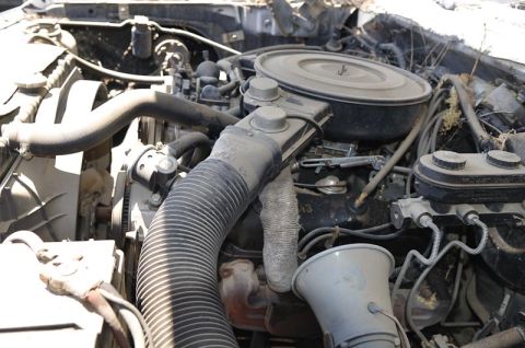 1987 Dodge 1500 - Close-up view of the engine compartment of a 1987 Dodge 1500, showing the air intake and brake system components.