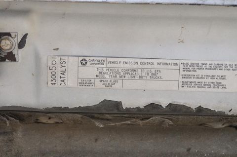 1987 Dodge 1500 - A vehicle emission control information sticker indicates the model year is 1987.