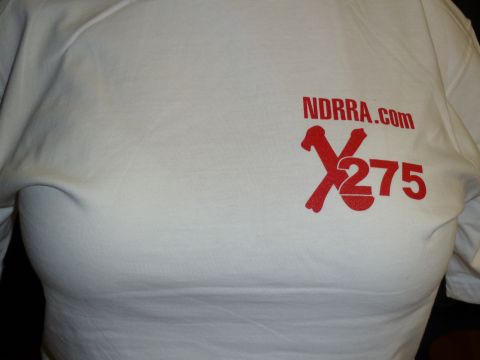 1992 Ford Mustang - A white t-shirt displays the text NDRRA.COM alongside a red graphic with an X and the number 275.