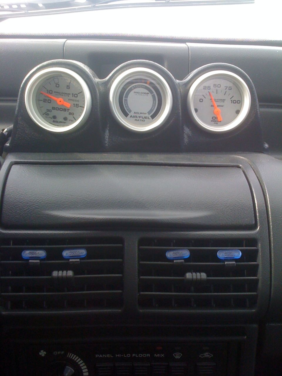 Interior gauges showing boost, air/fuel ratio, and oil pressure