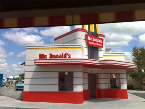 1991 Ford LTD Crown Victoria - A vintage blue car is visible near a classic McDonald's restaurant with a distinctive 1950s architectural style.