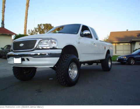 1995 Ford Bronco - This lifted 1997 Ford F-150 features large off-road tires and chrome wheels.