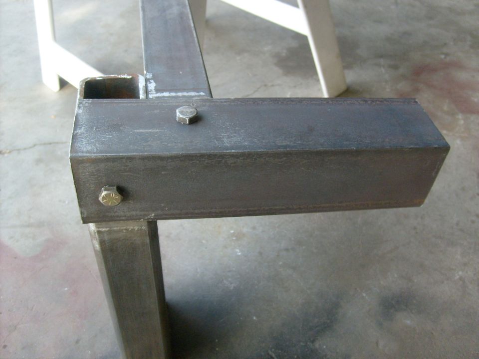 Metal frame section with bolts