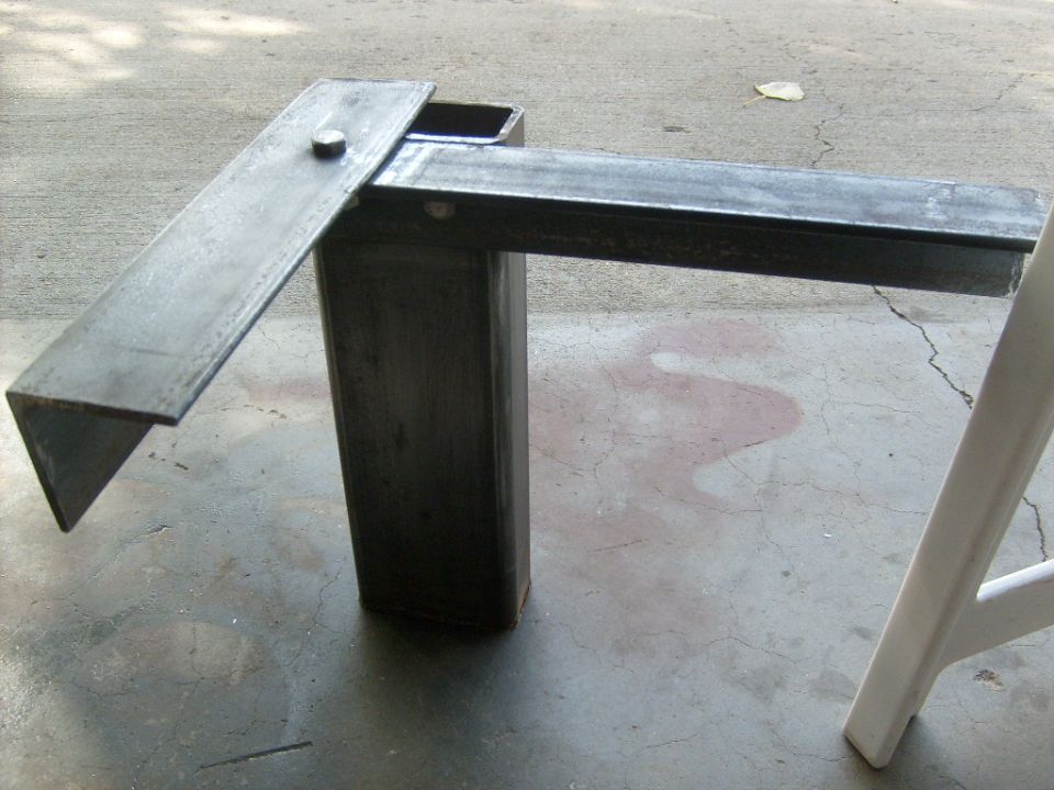 Metal bracket made of square tubing and flat stock, bolted together
