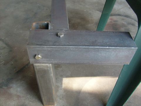 1986 Ford Bronco - This image shows a close-up view of a metal frame, likely a component or part, secured with bolts.