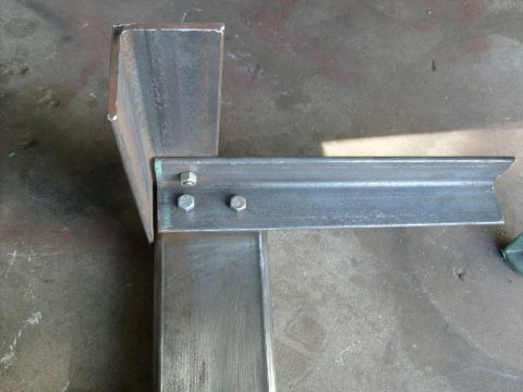 1986 Ford Bronco - Close-up view of metal brackets and bolts, likely part of a custom fabrication or repair project.