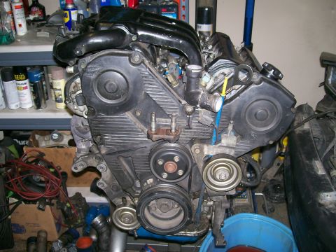 1995 Ford Probe - This is a close-up view of an engine assembly, likely removed from a vehicle for repair or replacement.