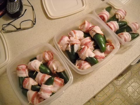 1996 Ford F-250 - Several plastic containers filled with jalapenos wrapped in bacon are ready for cooking.
