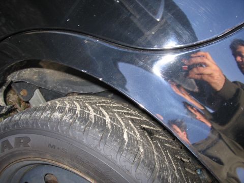 1991 Ford LTD Crown Victoria - The reflection in the car's fender shows a person holding a camera, taking the picture.