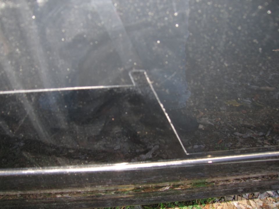 Black car panel with a rectangular cut-out and a thin horizontal trim piece