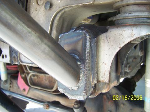 1995 Ford Bronco - Close-up view of a custom welded suspension part on a vehicle, with a date stamp of 02/16/2006.