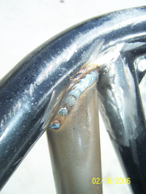 1995 Ford Bronco - Welded metal tubing with a visible date stamp and website URL.