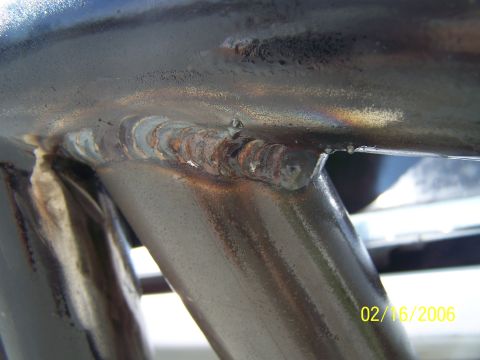 1995 Ford Bronco - Close-up view of metal tubing with visible welds and a date stamp from 2006.
