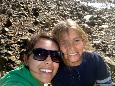 1996 Ford Bronco - Two people pose for a selfie outdoors with a rocky background.