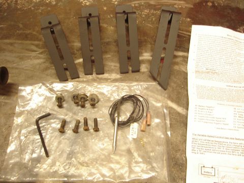1989 Ford Bronco - Parts and instructions for an electric fan kit are laid out on a textured surface.