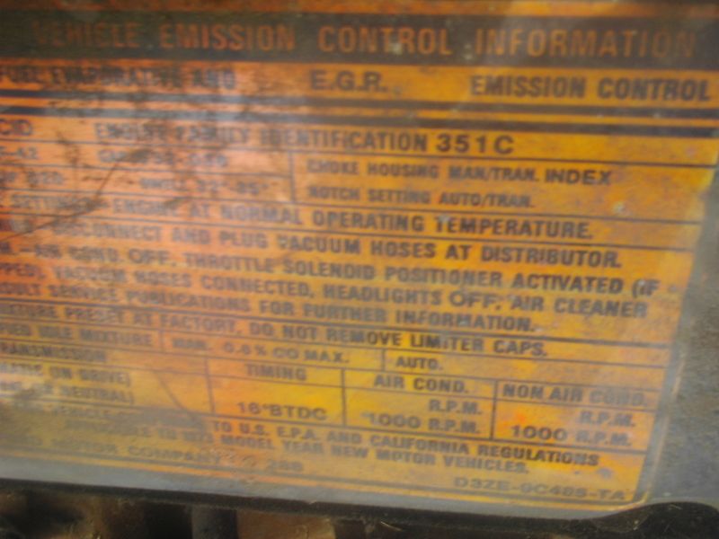 Worn Ford 351C vehicle emission control information decal with 16°BTDC timing and 1000 RPM idle