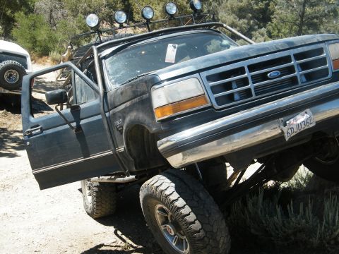 1982 Ford Bronco - This modified Ford truck appears to be from the early to mid-1990s, not a 1982 Bronco.