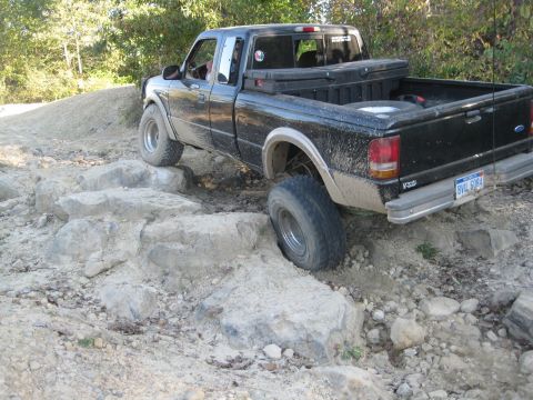 1995 Ford Ranger - This pickup truck is shown off-roading over a rocky terrain.
