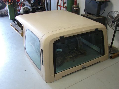 1993 Jeep YJ - A tan hardtop for a Jeep is shown, likely for a YJ model, in a workshop setting.