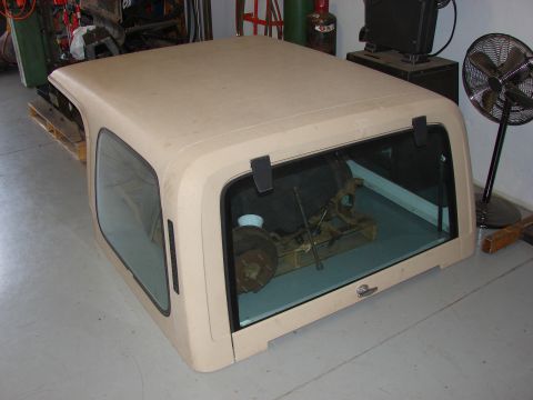 1993 Jeep YJ - This is a Jeep hardtop, not a full vehicle. A spare tire and tools are visible inside.