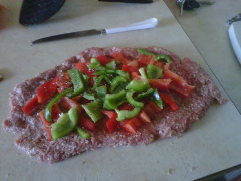 1986 Ford Bronco - Preparing a meatloaf topped with chopped peppers on a kitchen counter.