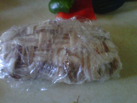 1986 Ford Bronco - Food wrapped in plastic on a counter, with a green pepper and red pepper visible.