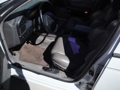 1989 Ford Taurus - Interior view of a 1989 Ford Taurus, highlighting the driver's side and passenger seats.