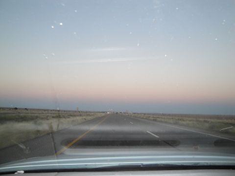 1989 Ford Taurus - Highway view at dusk with a soft gradient of colors in the sky.