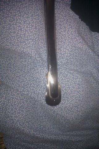 1991 Ford Crown Victoria - A chrome trim piece is shown against a blue patterned fabric, with Supermotors.net visible at the bottom.