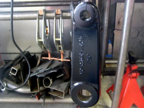 1996 Ford Bronco - A black metal steering component with part numbers and a Ford logo is shown, not a 1996 Ford Bronco.