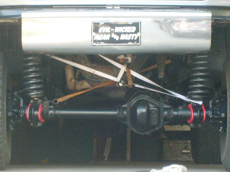 Rear axle and suspension with custom license plate reading 'EVIL-WICKED MEAN & NASTY'