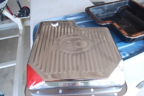 1982 Ford Bronco - Chrome oil pan with C6 designation and red corner accent sits beside a gasket.