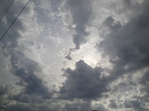 1989 Ford Taurus - Dark clouds gather in the sky, creating a dramatic, stormy atmosphere.