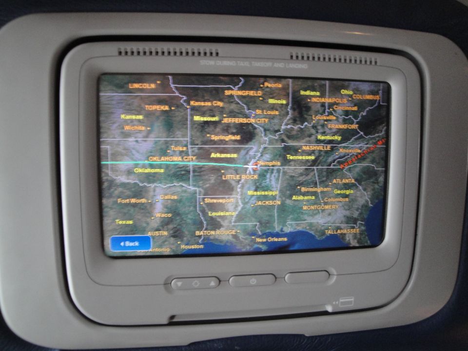 In-flight entertainment screen showing a map of the central United States with flight path