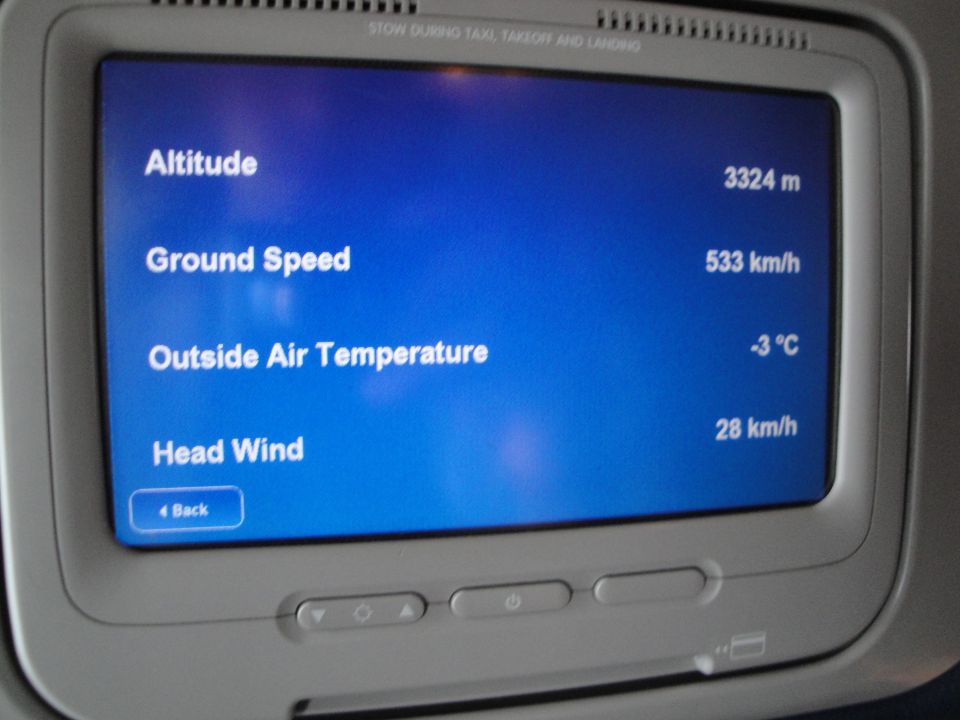 In-flight screen displays altitude, ground speed, outside air temperature, and head wind