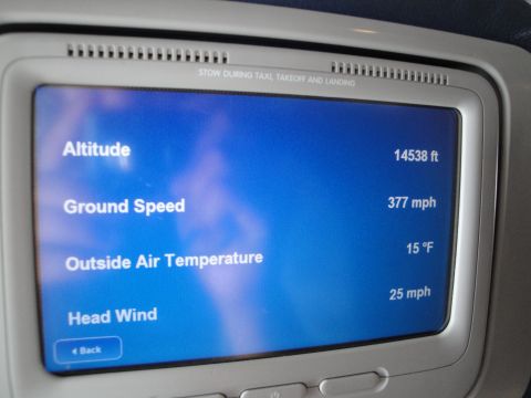 1989 Ford Taurus - The in-flight entertainment system displays current flight data including altitude, speed, and temperature.