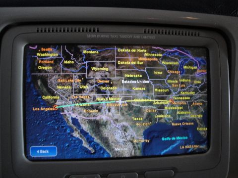 1989 Ford Taurus - An in-flight entertainment screen displays a map of the United States, highlighting a flight path.