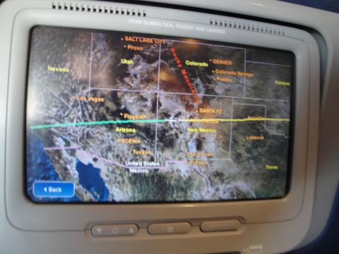 1989 Ford Taurus - An in-flight entertainment screen shows a map of the western United States, including major cities and geographical features.