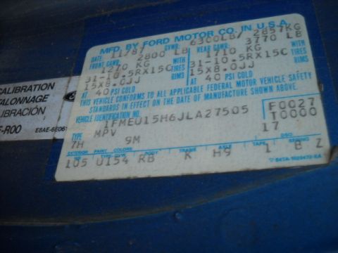 1993 Ford F-150 - A close-up of a vehicle identification sticker shows manufacturing details and VIN.